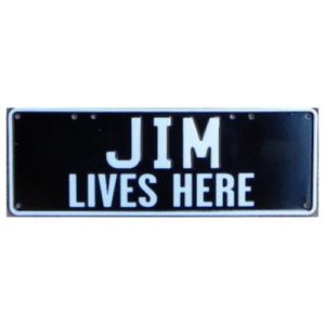 Novelty Number Plate - Jim Lives Here 2 Line - White On Black 1 Stickerplate