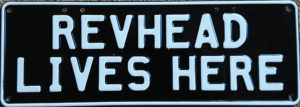 Novelty Number Plate - Revhead Lives Here - White On Black
